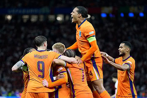 Virgil van Dijk celebrates after Stefan de Vrij scored Netherlands's first goal